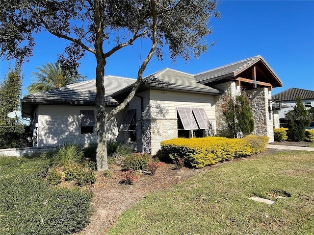 view of side of home featuring a yard