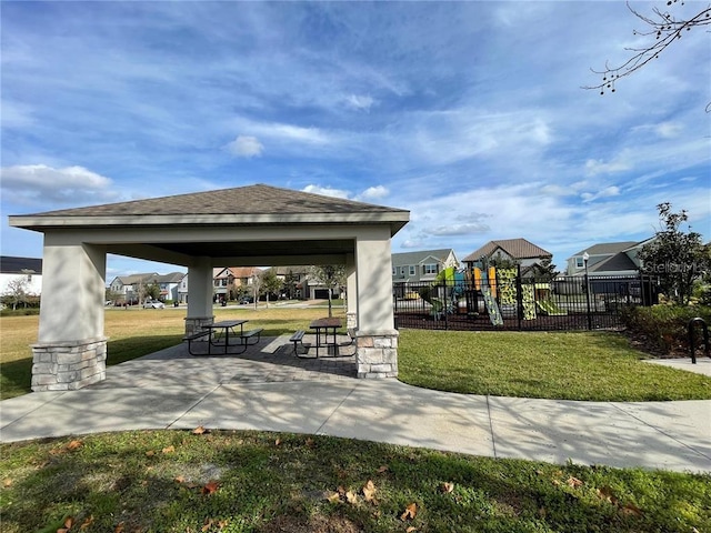 surrounding community with a gazebo, a playground, and a yard