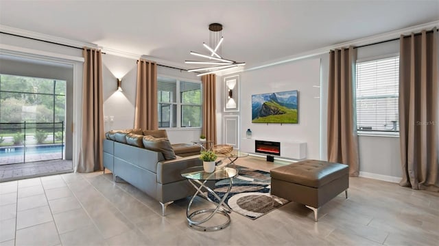 tiled living room with a wealth of natural light, an inviting chandelier, and crown molding