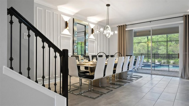 dining room with a healthy amount of sunlight, a notable chandelier, tile flooring, and crown molding