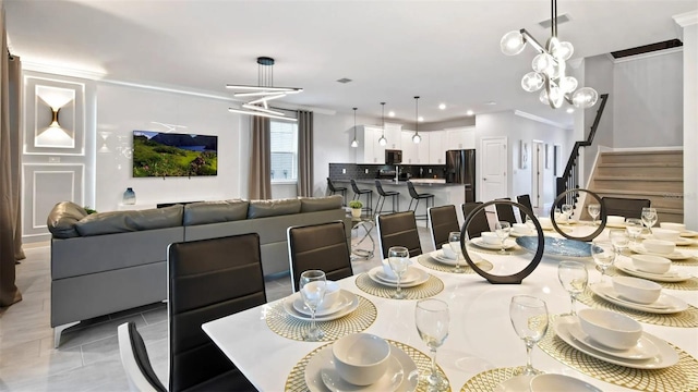 tiled dining area with a notable chandelier and ornamental molding