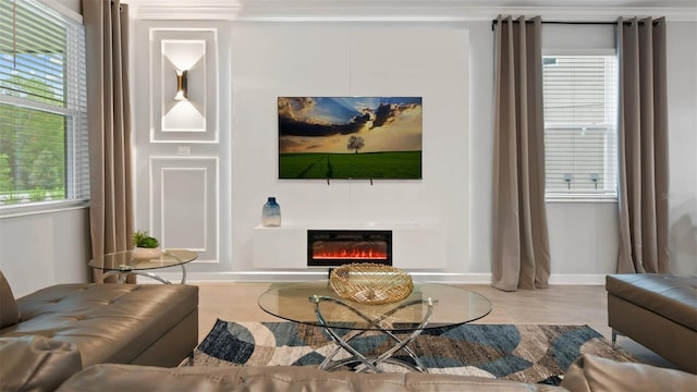 living room featuring ornamental molding, plenty of natural light, and light tile floors