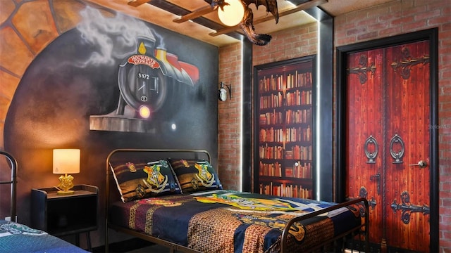 bedroom with brick wall and ceiling fan