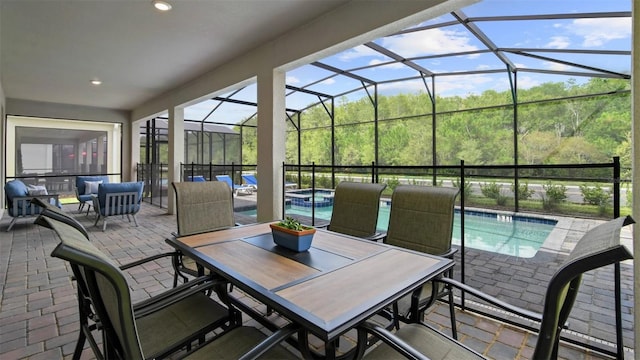 sunroom / solarium featuring vaulted ceiling