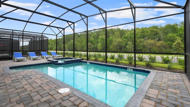 view of swimming pool featuring a patio area, glass enclosure, and an in ground hot tub