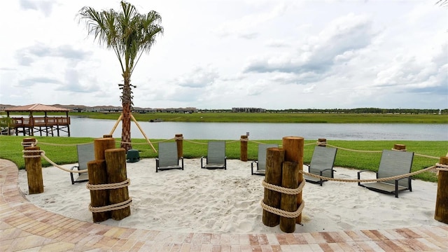 view of patio / terrace with a gazebo and a water view