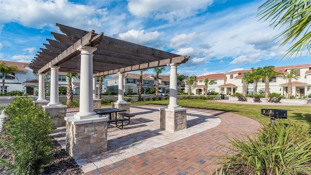 surrounding community with a pergola and a yard