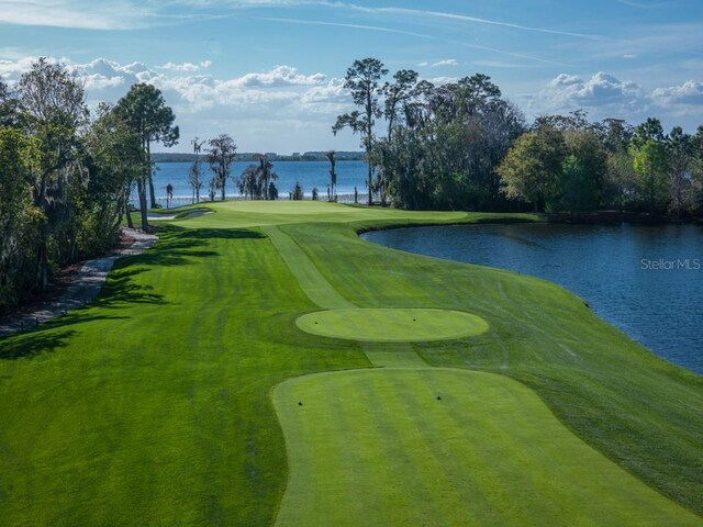 view of nearby features featuring a water view and a lawn