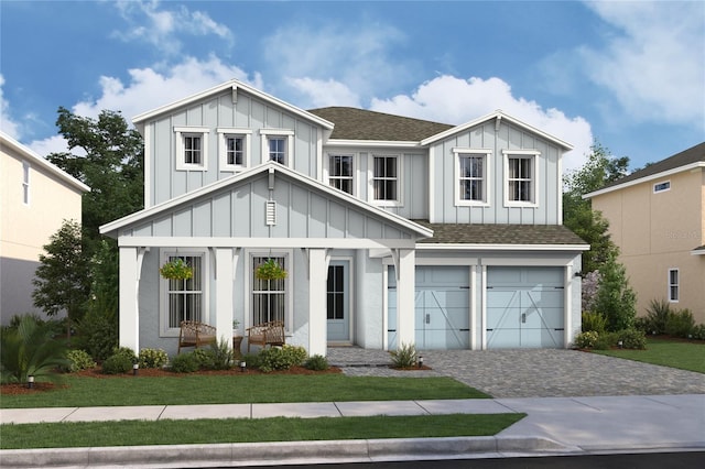 view of front of home featuring a garage and a front yard