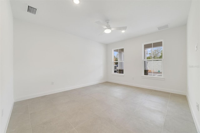 spare room with ceiling fan