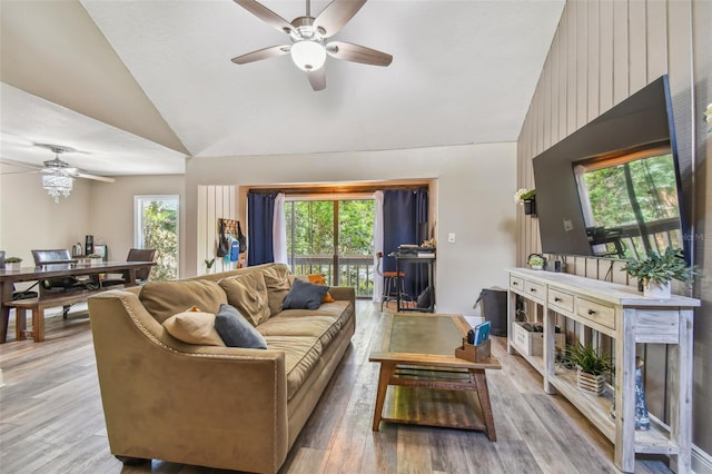 living room featuring high vaulted ceiling, ceiling fan, and hardwood / wood-style flooring