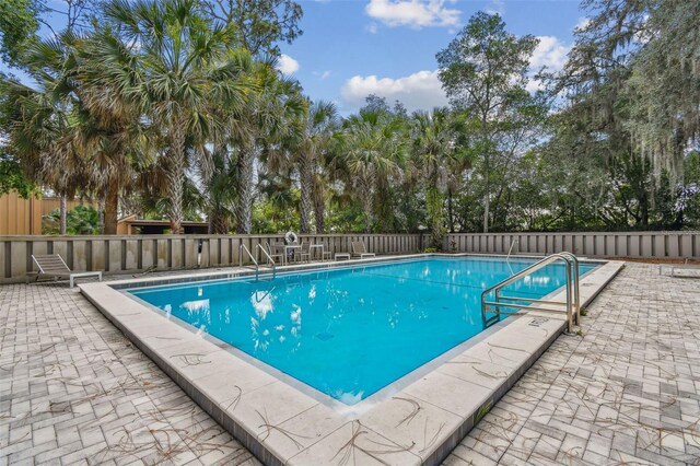 view of pool featuring a patio