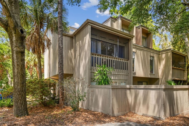 view of side of property featuring a balcony