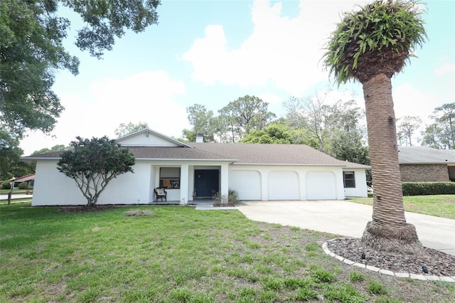 single story home featuring a garage and a front lawn