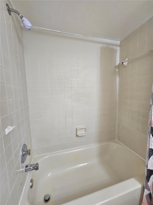 bathroom with shower / bath combination with curtain