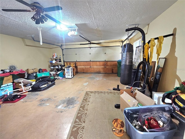 garage with ceiling fan and a garage door opener