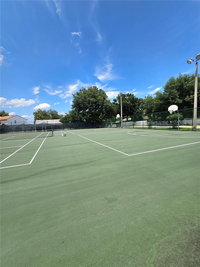 view of tennis court featuring basketball court