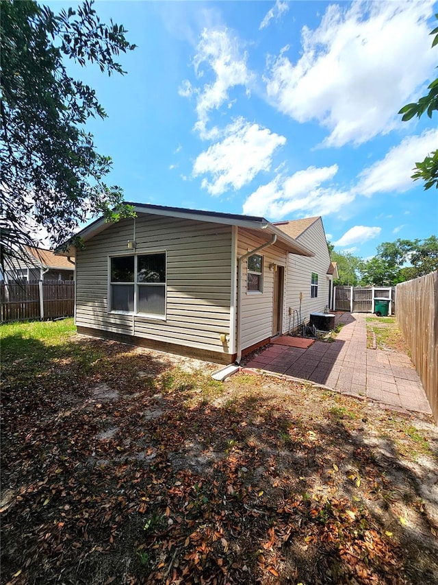 rear view of house featuring a patio