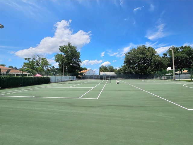 view of sport court featuring basketball hoop