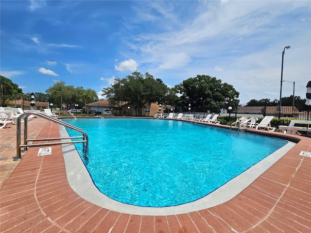 view of swimming pool featuring a patio