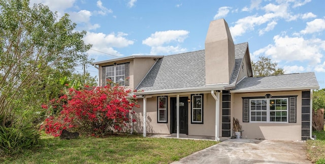 exterior space with a patio and a lawn