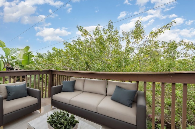 wooden terrace featuring an outdoor living space