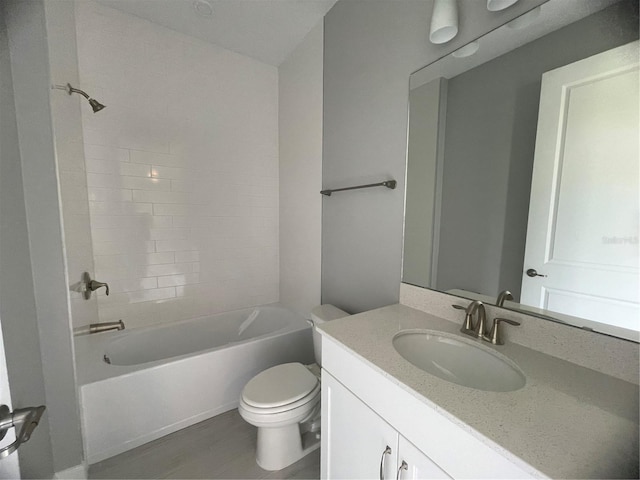 full bathroom with vanity, hardwood / wood-style floors, bathtub / shower combination, and toilet