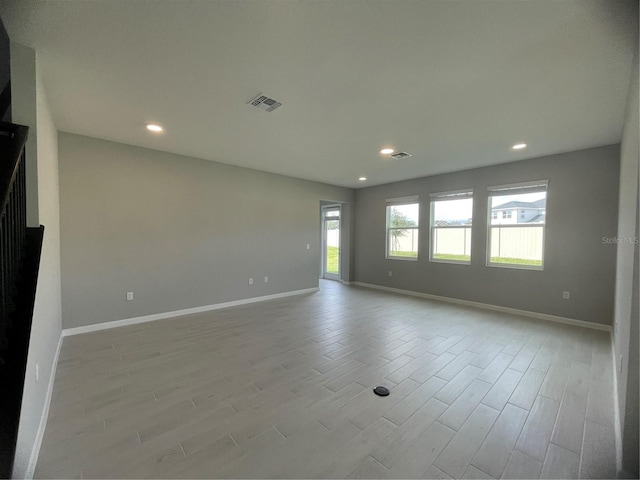 empty room with light hardwood / wood-style floors