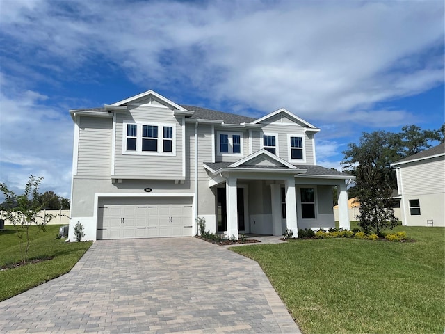 view of front of house featuring a garage and a front yard