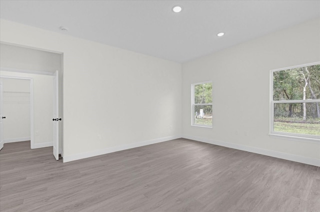 spare room featuring light wood-type flooring