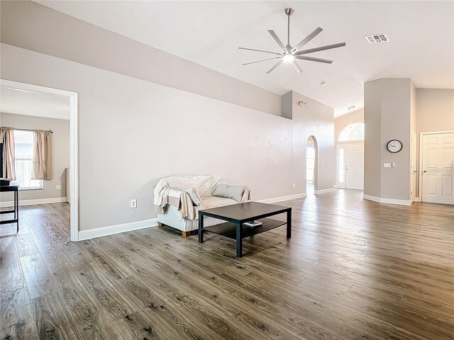 living room featuring hardwood / wood-style floors, high vaulted ceiling, and ceiling fan