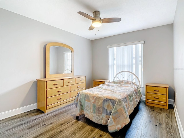 bedroom with ceiling fan and hardwood / wood-style floors