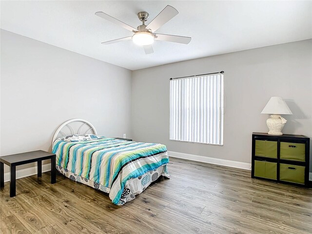 bedroom featuring wood-type flooring and ceiling fan