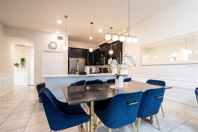 dining space featuring light tile patterned flooring