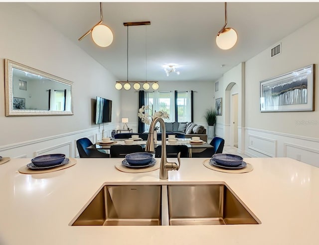 kitchen featuring sink and hanging light fixtures