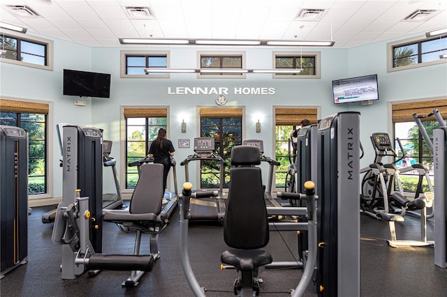 workout area featuring a high ceiling