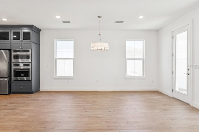 kitchen with visible vents, a healthy amount of sunlight, and appliances with stainless steel finishes