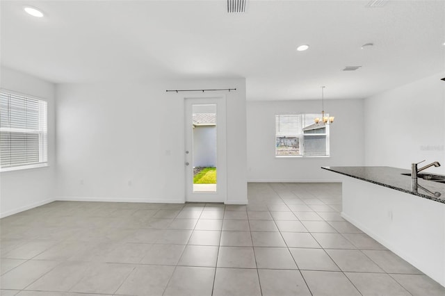 5115 Lake Hamlin Trl, Winter Garden, FL 34787 - empty room featuring sink, an inviting chandelier, and light tile floors
