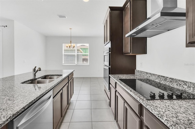 5115 Lake Hamlin Trl, Winter Garden, FL 34787 - kitchen with dishwasher, hanging light fixtures, wall chimney exhaust hood, sink, and stovetop
