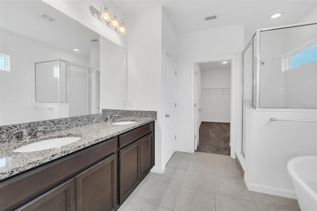 5115 Lake Hamlin Trl, Winter Garden, FL 34787 - bathroom featuring large vanity, tile flooring, double sink, and plus walk in shower