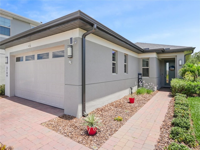 view of side of home featuring a garage