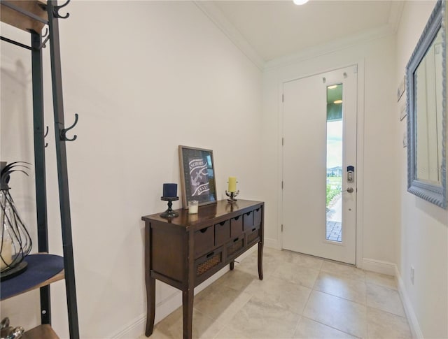 tiled foyer entrance with crown molding