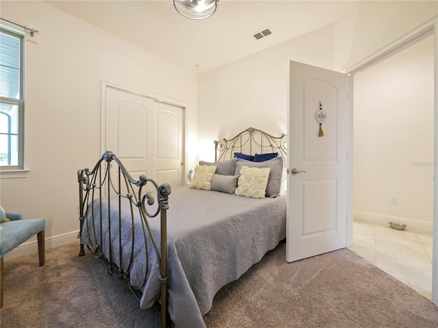 carpeted bedroom with a closet