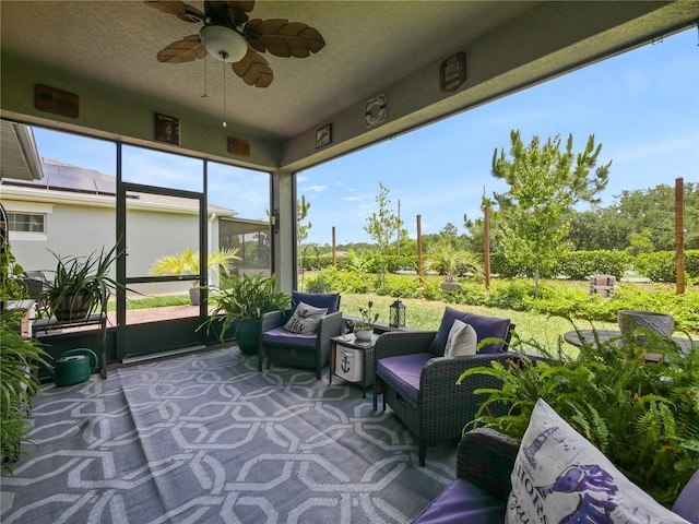 sunroom featuring ceiling fan