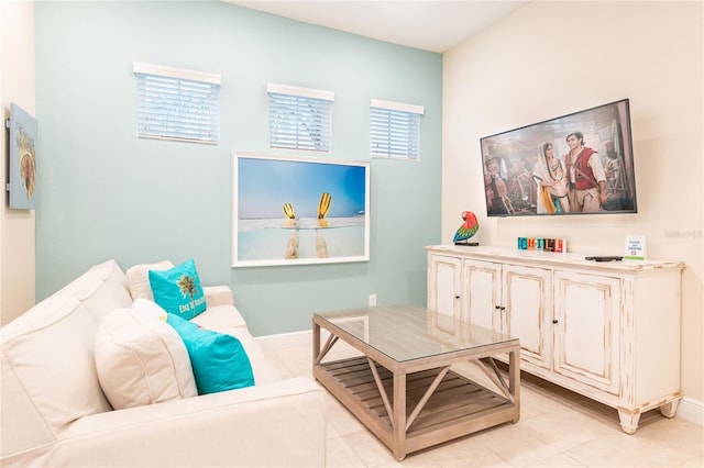 living area featuring light tile patterned flooring