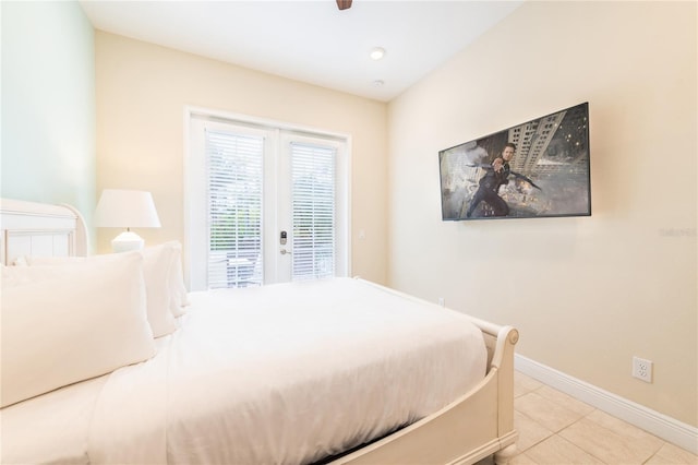 tiled bedroom featuring access to exterior, ceiling fan, and french doors