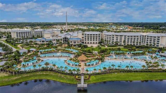 birds eye view of property with a water view