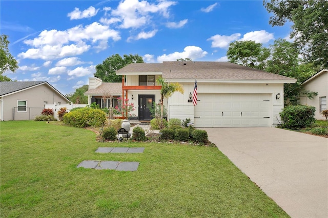 view of front facade featuring a front yard and a garage