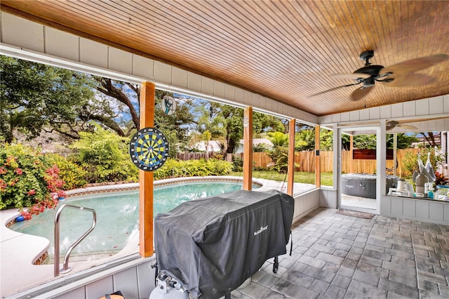 exterior space featuring ceiling fan and wooden ceiling