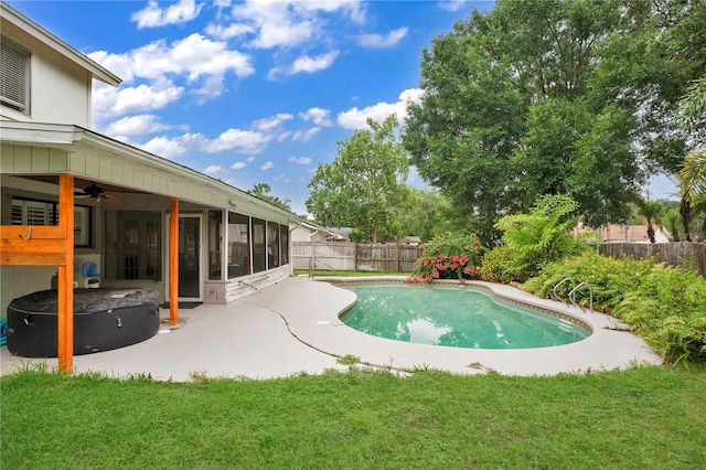 view of pool featuring a patio area, a lawn, and ceiling fan